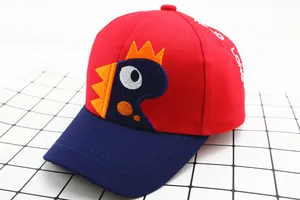 Detail of child baseball cap with dinosaur embroidery and Long Long letter stitching