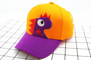 Detail of orange and purple kids baseball cap with a cute cartoon dinosaur embroidery