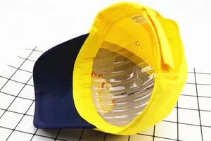 Detailed interior of a kids baseball cap featuring 100% cotton fabric and neat stitching