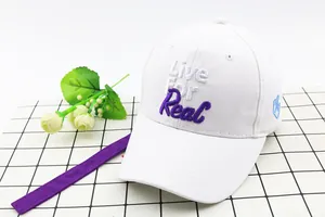 Detail of white cotton baseball cap featuring 3D text embroidery and long purple strap
