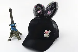 Detail of cute black kids baseball cap with bunny ears, lace, and breathable mesh