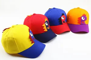 Detail of four colorful kids baseball caps with 3D cartoon dinosaur eye embroidery