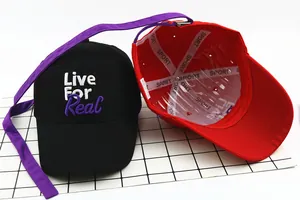 Detail of child baseball cap showing Live For Real embroidery and inner sport lining