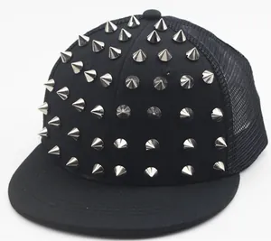 Detail of black snapback trucker hat featuring silver metal cone rivets and mesh back