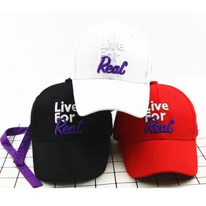 Three kids baseball caps in black, white, and red with Live For Real 3D embroidery