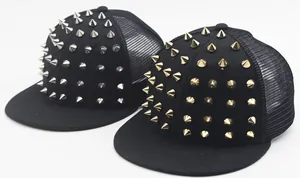 Detail of punk style flat brim baseball hats with silver and gold metallic rivet spikes