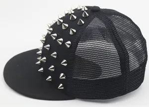 Detailed side view of black trucker hat featuring silver metal punk rivets and mesh back