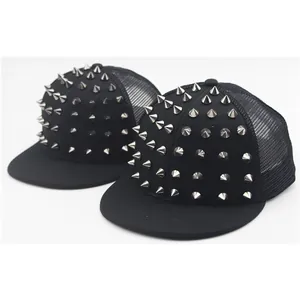 Two black hip-hop trucker hats with silver punk rivets and breathable mesh back in white background