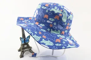 Detail of dark blue cotton sun hat with ocean cartoon prints and windproof drawstring