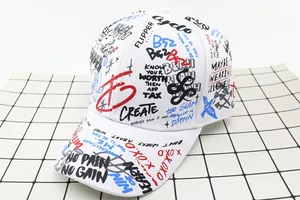 Detailed top view of white cotton baseball cap with colorful graffiti print and mottos
