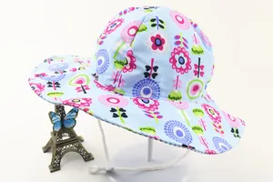 Close-up of baby sun hat with colorful floral patterns and breathable cotton wide brim