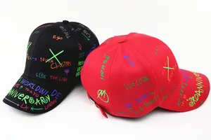 Detail view of cotton baseball caps with colorful street graffiti prints and metal buckle