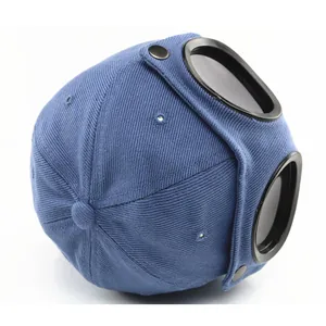 Kids navy pilot baseball cap featuring integrated black goggles on the back view