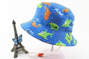 Detail of blue kids sun hat with cartoon shark print and orange adjustable wind rope