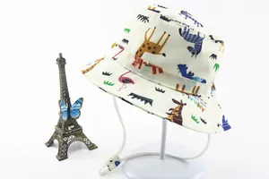 Detailed view of kids cotton sun hat with colorful cartoon animal prints and chin strap