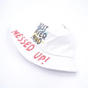 Detail of white cotton bucket hat featuring street style graffiti print and neat stitching