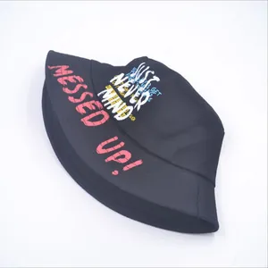 Unisex black canvas bucket hat featuring pink MESSED UP graffiti art and street style print