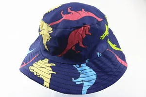 Close-up of kids bucket hat with colorful cartoon dinosaur patterns and stitched brim