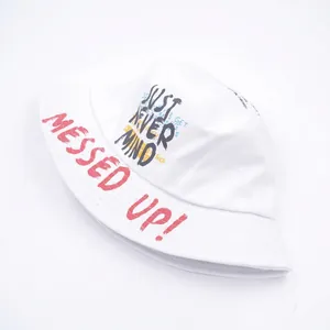 White canvas bucket hat with street style graffiti print and Messed Up text detail