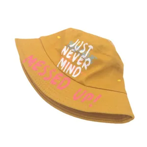 Mustard yellow cotton bucket hat featuring stylish 'JUST NEVER MIND' graphic print
