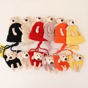 Close-up of knit baby hat and bear bag set in six colors with teddy bear 3D accents