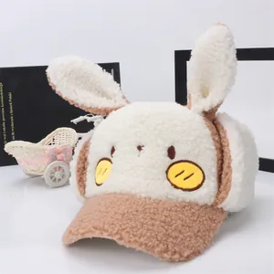 Cute children's winter plush baseball cap with rabbit ears and earflaps in cream and camel