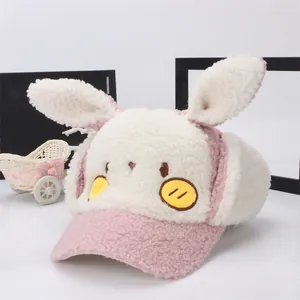 Cute pink and beige plush bunny ear winter baseball cap with warm earflaps for kids