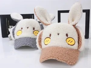 Detail of plush lamb wool kids baseball cap with rabbit ears and warm ear protection