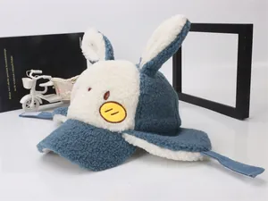 Close-up of children's thick sherpa winter hat with plush rabbit ears and earflaps