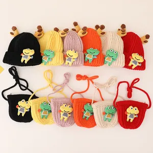 Flat lay of knit beanies and mini bags set featuring deer antlers and frog patches in six colors