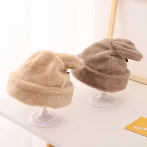 Plush winter beanies with cute rabbit ears and warm fleece lining in beige and brown