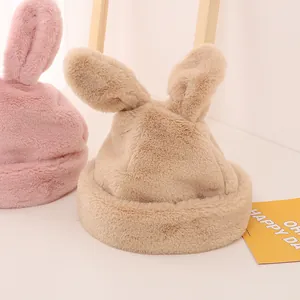 Close-up of soft plush rabbit ears and thick velvet lining on kid's warm winter hat
