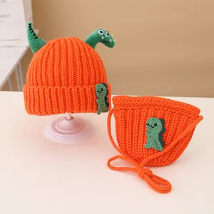 Kids orange knitted hat and matching crossbody bag set with cartoon dinosaur elements