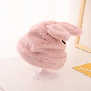 Detailed view of pink plush toddler winter hat with soft faux fur and cute rabbit ears