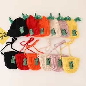 Detailed view of children's knitted hat and bag set with 3D dinosaur accents in six colors