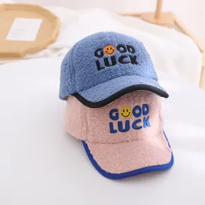 Winter sherpa baseball cap for kids with Good Luck embroidery in blue and pink