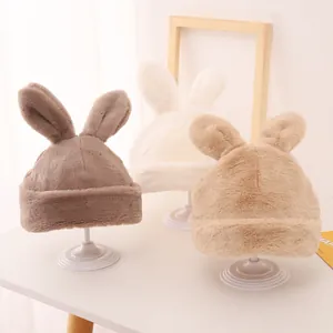 Plush winter beanies with cute long rabbit ears for kids in brown and cream tones