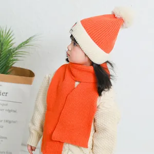 Winter warm knitted orange and white set for kids including strawberry hat and scarf