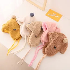 Kids winter fleece trapper hats with ear flaps and pom-poms in five warm colors