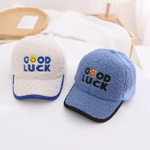 Detail of Good Luck embroidery on soft sherpa fleece baseball caps for kids