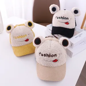 Detail showing toddler caps in sherpa fleece and corduroy with cartoon embroidery
