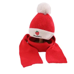 Winter children's knitted hat and scarf set with strawberry patterns and soft pompom