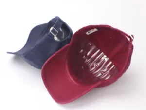 Detail of adjustable metal buckle and inner lining on cotton 1985 baseball caps
