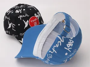 Detail of kids graffiti baseball cap with adjustable metal buckle and interior sweatband