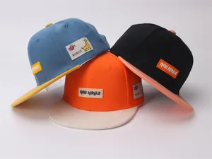 Detailed view of kids color-block flat brim baseball caps with giraffe logo patches