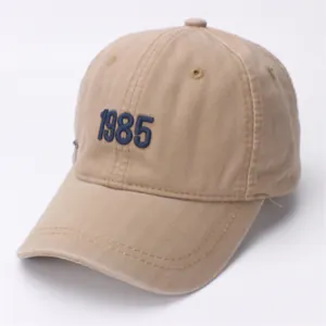 Washed khaki cotton baseball cap for kids with 1985 embroidery and a curved brim