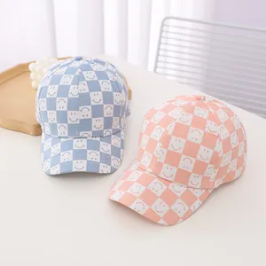 Kids' check pattern baseball caps with smiley face design in blue and orange colors