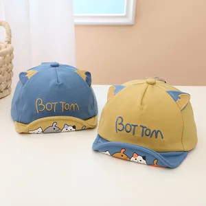 Detail of soft brim baby baseball caps with cute cat ears and animal illustrations