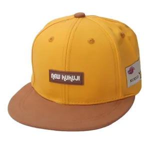 Yellow and brown color block kids flat brim baseball hat with brand logo patch