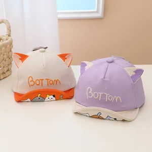 Detail of two toddler baseball caps with cute 3D animal ears and cartoon embroidery